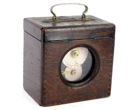 A Belgica pigeon clock, in an oak case, no. 16756, 18cm wide.