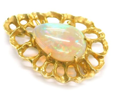 A pear shaped opal brooch, set with single opal approx 17.2mm x 12mm, with a strong green colour, in a yellow metal six claw 