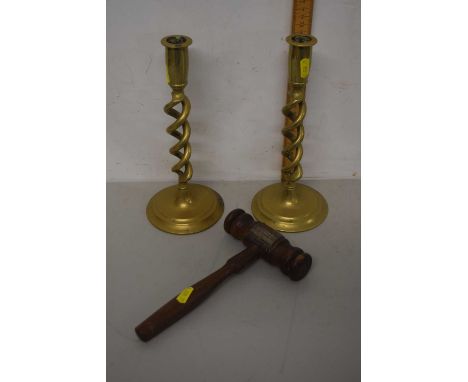 A pair of brass barley twist candle sticks together with a presentation gavel marked Presented to Miss Lydia Walton on the oc