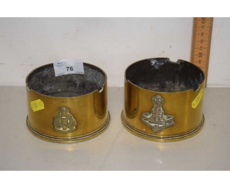 A pair of trench art brass ashtrays formed from the ends of shell cases