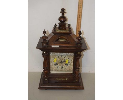 A 20th Century mantel clock in architectural hardwood case