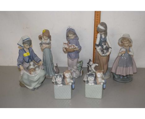 Collection of Lladro figures of children with kittens together with two further models of kittens in baskets (7)
