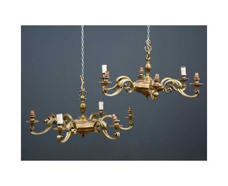 A pair of brass six branch chandeliers, the scrolled arms radiating from a central circular dish, 84cm diameter x approximate