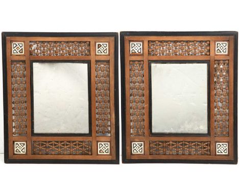 A pair of Moorish mirrors, the central rectangular mirror plate surrounded by mother of pearl and ivory inlaid corners and wi