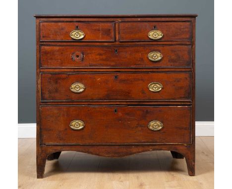 A George III mahogany veneered chest of two short over three long graduated drawers, on tapered bracket supports, 94cm wide x