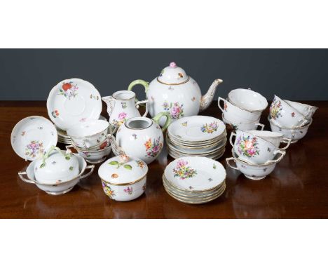 A collection of ceramics by Herend Hungary to include tea cups and saucers, side plates, a sugar bowl and cover, tea bowls, a