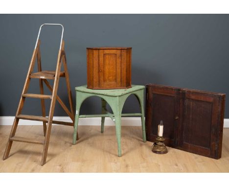 An old step ladder with chromed hooping handle to the top, 53cm high while folded flat; a stained pine wall hanging two door 