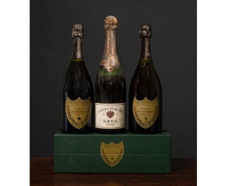 A bottle of Champagne Krug 1969 and two bottles of Champagne Dom Perignon 1982, 1993 (3).Condition report: Oxidation to foil,