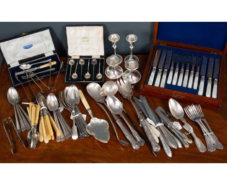 A collection of metalware including a set of six knives and forks with mother of pearl handles (boxed), a set of six coffee s