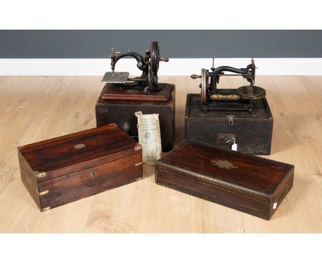 A Wilcox &amp; Gibbs sewing machine, cased, with original instruction manual, 32.5cm wide x 21cm deep x 27cm high, a Charles 