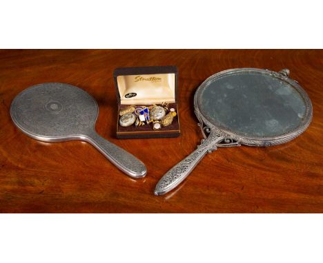 A Tiffany and Co. silver hand mirror, 12cm wide x 27cm long, a silver plated hand mirror, with pierced decoration and finial 