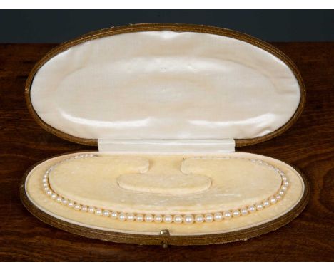 A cultured pearl necklace with gem set fastening, cased, 38cm longCondition report: Case a little worn