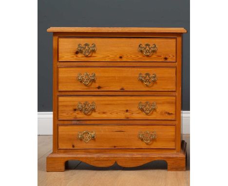 A pair of pine bedside tables of four drawers on bracket feet, 53cm wide x 34cm deep x 56cm high (2)Condition report: At pres