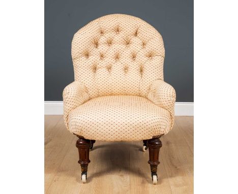 A Victorian button upholstered low chair with brass and ceramic casters, 60cm wide x 55cm deep x 85cm highCondition report: I