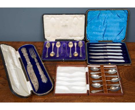 A group of silverware to include a silver carving knife and fork (cased), a set of six silver teaspoons (cased), a set of six