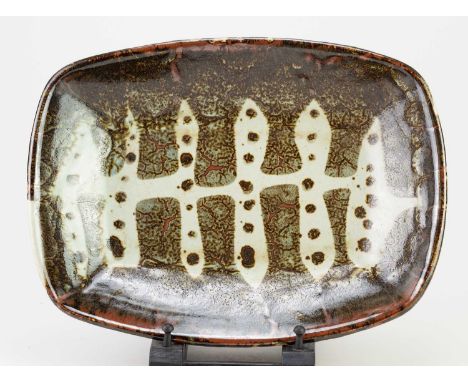 † Attributed to RAY FINCH (1914-2012) for Winchcombe Pottery; a rectangular stoneware dish with wax resist decoration, impres
