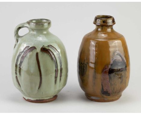 † MIKE DODD (born 1943); a flat sided stoneware bottle with side handle covered in nuka glaze with wax resist decoration, hei