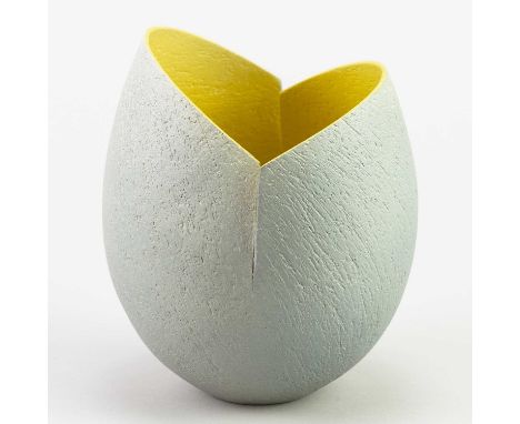 † ASHRAF HANNA (born 1967); a stoneware vessel with cut and altered rim and textured light grey surface to exterior and yello