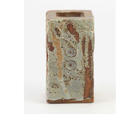 † IAN AULD (1926-2000); a rectangular stoneware slab vase partially covered in running grey/green glaze with impressed decora