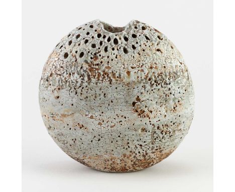 † ALAN WALLWORK (1931- 2019); a stoneware pebble with impressed decoration picked out in green glaze above bands of white and