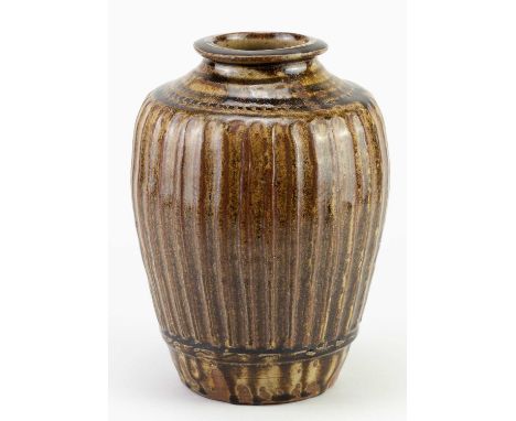 † MIKE DODD (born 1943); a fluted stoneware bottle covered in peat clay glaze, impressed MJD mark, height 23cm.Condition Repo