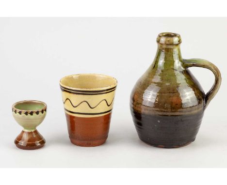 † RAY FINCH (1914-2012) for Winchcombe Pottery; a slipware flagon covered in green galena and iron glaze, impressed RF and po
