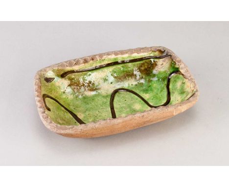 † Attributed to RAY FINCH (1914-2012) for Winchcombe Pottery; a press moulded rectangular slipware dish with pie crust rim pa