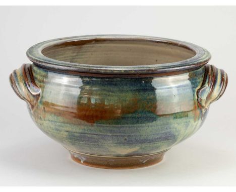 † JOE FINCH (born 1947); a large stoneware planter partially covered in a mottled petrol blue glaze, impressed JF mark, diame