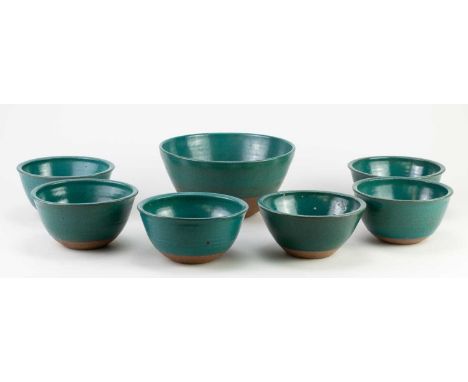 † DAVID LLOYD JONES (1928-1994); a stoneware bowl covered in turquoise glaze, impressed mark, diameter 19.5cm, and a set of s