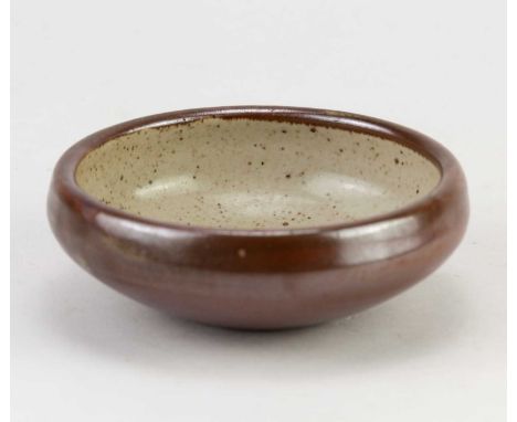 † BERNARD LEACH (1887-1979) for Leach Pottery; a small stoneware dish with iron decoration on oatmeal ground, painted BL and 