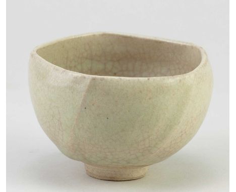 † KATHARINE PLEYDELL-BOUVERIE (1895-1985); a small faceted stoneware bowl covered in pale green crackle glaze, impressed KPB 