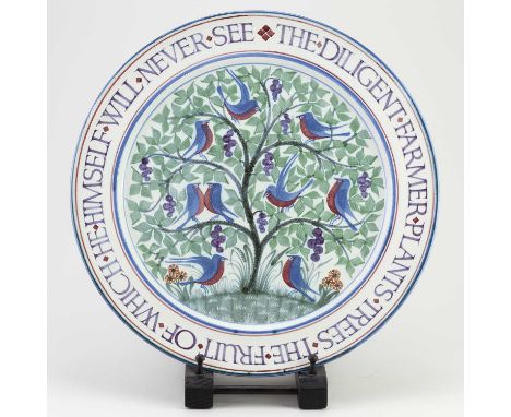 † LAURENCE McGOWAN (born 1942); a Maiolica style stoneware charger decorated with birds in a tree, inscribed 'The diligent fa