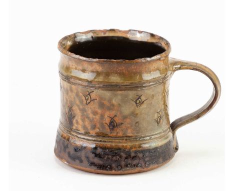† MICHAEL CARDEW (1901-1983) for Winchcombe Pottery; a slipware mug covered in motted yellow/green galena and iron glaze, imp