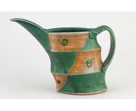JEFF OESTREICH (born 1947); a faceted stoneware beaked pitcher, impressed JO mark, height 16.5cm. Provenance: Kevin de Choisy