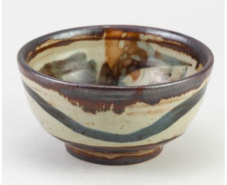 LADI KWALI (1925-1984) for Wenford Bridge Pottery; a small stoneware bowl covered in pale grey glaze with iron and cobalt Vum
