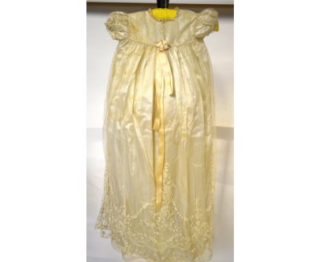 An ivory satin Christening robe overlaid with floral needle-run lace, a Victorian infant's slip with tiered lace, two ladies'