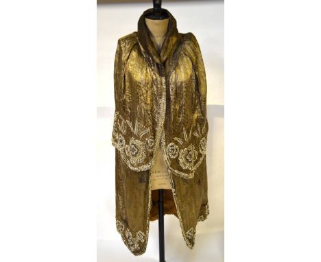 A 1920s embossed gold lame heavily beaded evening cloak (reputedly belonging to Fay Compton or Gertrude Lawrence and then pas