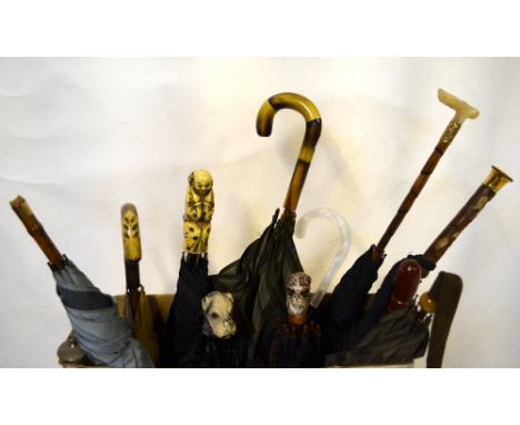 Thirteen assorted vintage gentlemen's and ladies' umbrellas including examples with dog head and mother-of-pearl grips