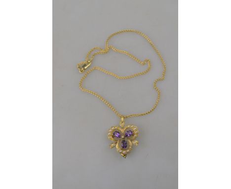 An Edwardian style amethyst and seed pearl trefoil pendant brooch with amethyst drop, 9ct yellow gold on 9ct chain