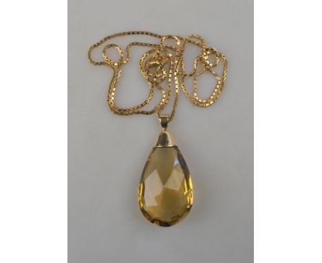 A faceted citrine drop, yellow metal set, setting stamped 9ct on box link gold chain stamped 375, approx 14g (chain) Conditio