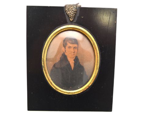 A Regency oval watercolour and ink portrait miniature on card of a young gentleman, unsigned, in ebonised frame, 8 x 6.5 cm