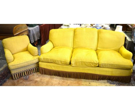 Howard Chairs Ltd, London, a contemporary three seater sofa triple hump backed sofa to/w a similarly upholstered Howard armch