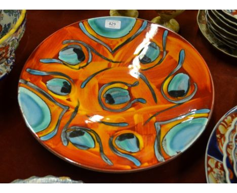 A Poole pottery 'Peacock' charger, 42 cm diam Condition Report Damage includes crazing