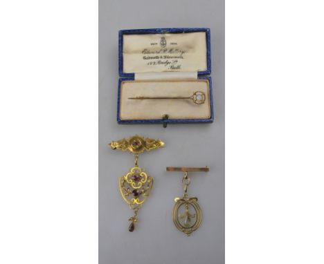 An almandine garnet and seed pearl Art Nouveau pendant suspended from a garnet set bar brooch to/w an aquamarine set pendant 