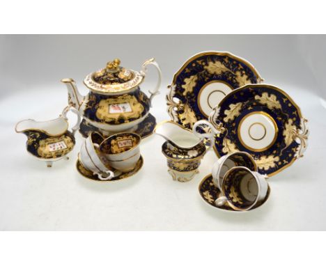 A 19th century Ridgway teapot, cover & stand, creamer, coffee cup, teacup and saucer, mazarine ground decorated with apricot 