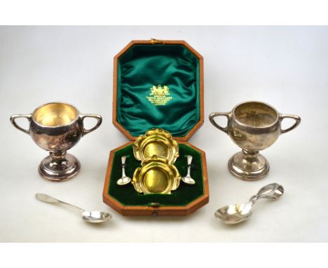 A cased pair of late Victorian parcel gilt open salts of quatrefoil form, Sheffield 1894, to/w a pair of trophy cups, Sheffie