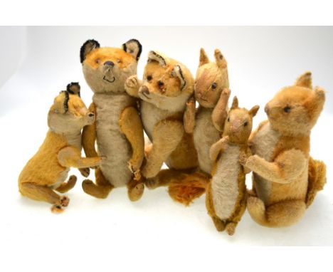 Three vintage straw-filled toy foxes and three squirrels (one squirrel and two foxes with Steiff ear-tags)