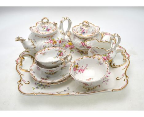 An early Victorian Ridgways cabaret set decorated with floral sprays within a scrolling gilt borders and comprising a square 