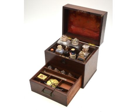 A George III mahogany apothecary box, the hinged top with brass folding campaign handle over a fitted interior containing an 