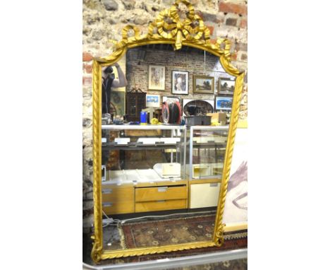 A 19th century giltwood framed overmantle mirror with ribbon bow arched pediment, 180 cm high x 110 cm wide